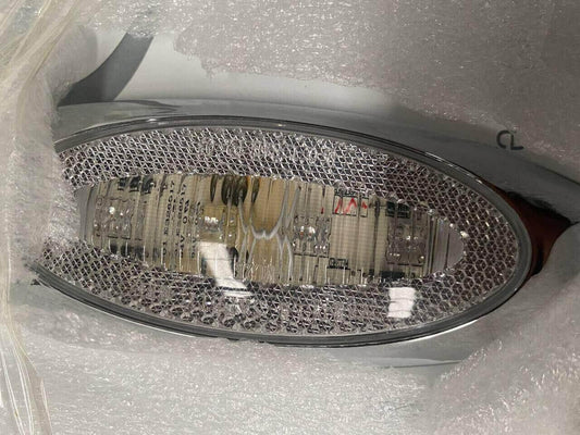 Chrome truck sleeper extender panel with built-in lights, wrapped in protective bubble wrap