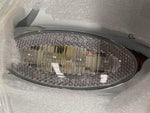 Chrome truck sleeper extender panel with built-in lights, wrapped in protective bubble wrap