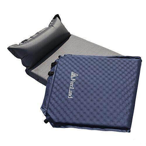 Blue self-inflating camping sleeping pad with attached pillow, compact and lightweight.