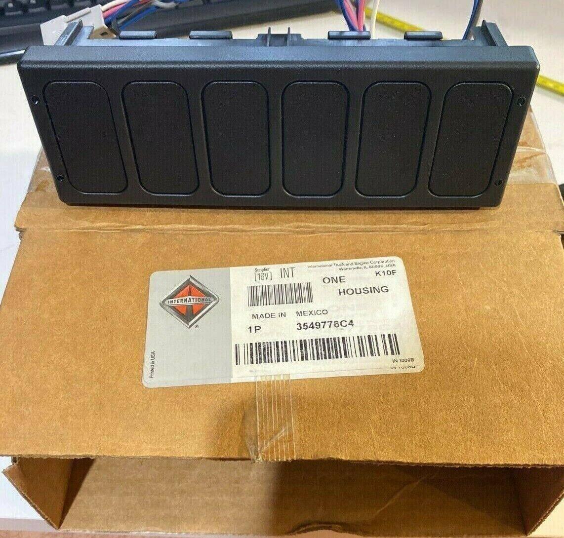 Black six-pack switch housing for International truck with wiring, shown on labeled box.