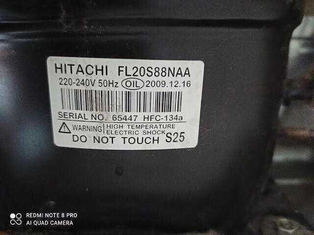 Hitachi FL20S88NAA refrigeration compressor label, 220-240V, warning sign visible.