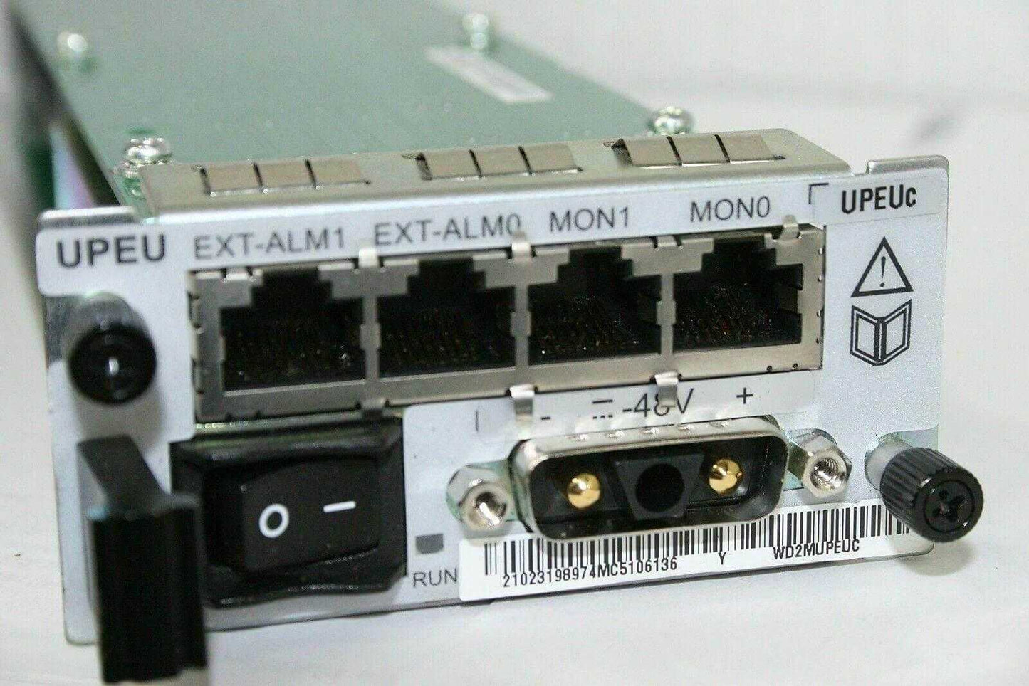 Close-up of a Huawei UPEUc interface unit with multiple network ports, power switch, and labels.