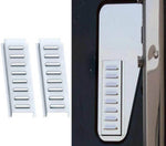 Pair of stainless steel louvered vent covers for ProStar sleeper truck, installed on door.