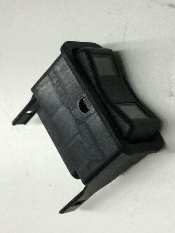 Black plastic on-off dash switch for International tractor or truck part
