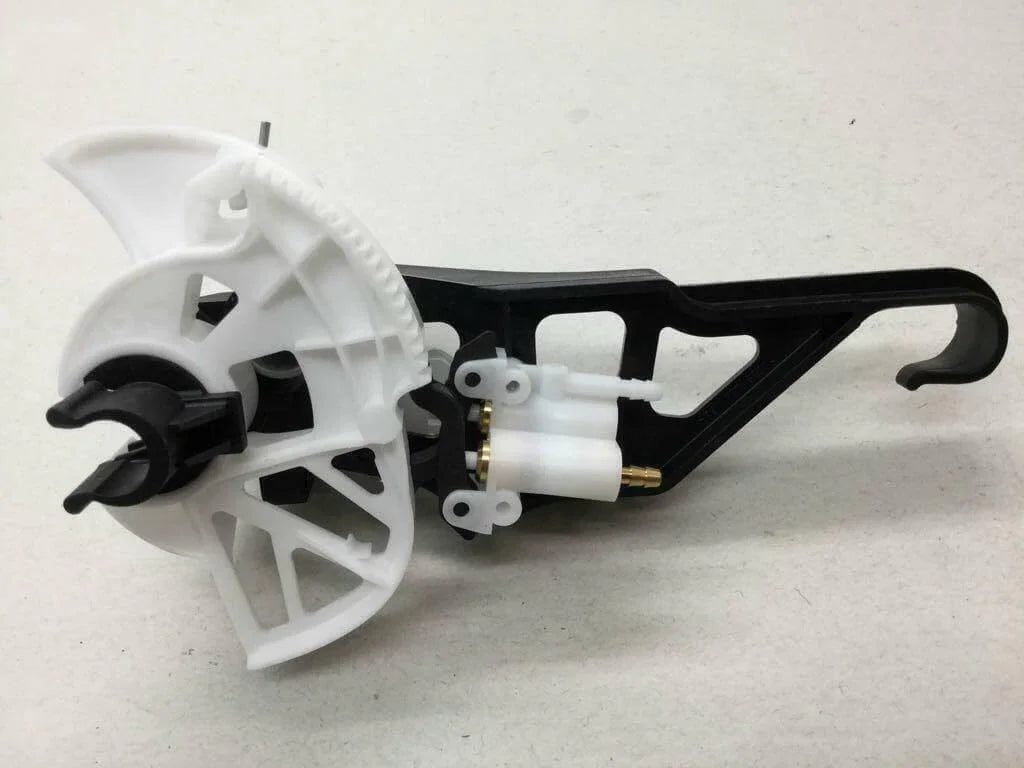 White and black truck valve gear service kit part on a light surface