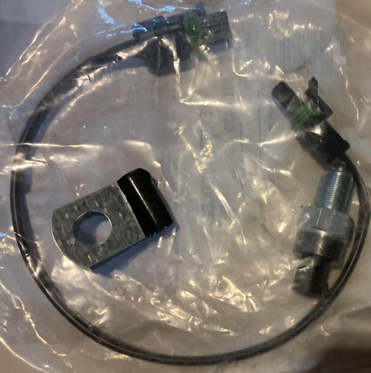 Truck lock switch wiring kit with connector and mounting bracket in plastic packaging