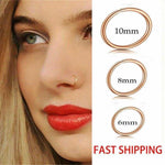Gold hoop nose ring worn by woman, available in 10mm, 8mm, and 6mm sizes.