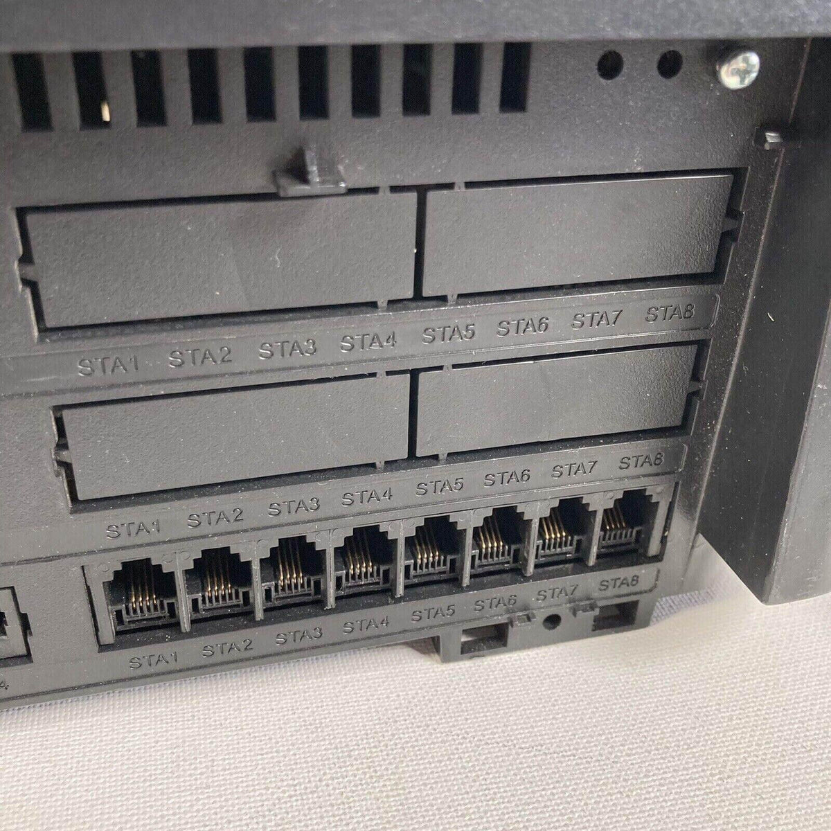 Ethernet network switch with labeled ports STA1 to STA8 for office phone systems