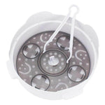 White plastic steamer basket with perforated base and handle for kitchen use