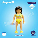 Playmobil Bikini Beach figure in yellow swimsuit holding towel, Series 1 collectible toy