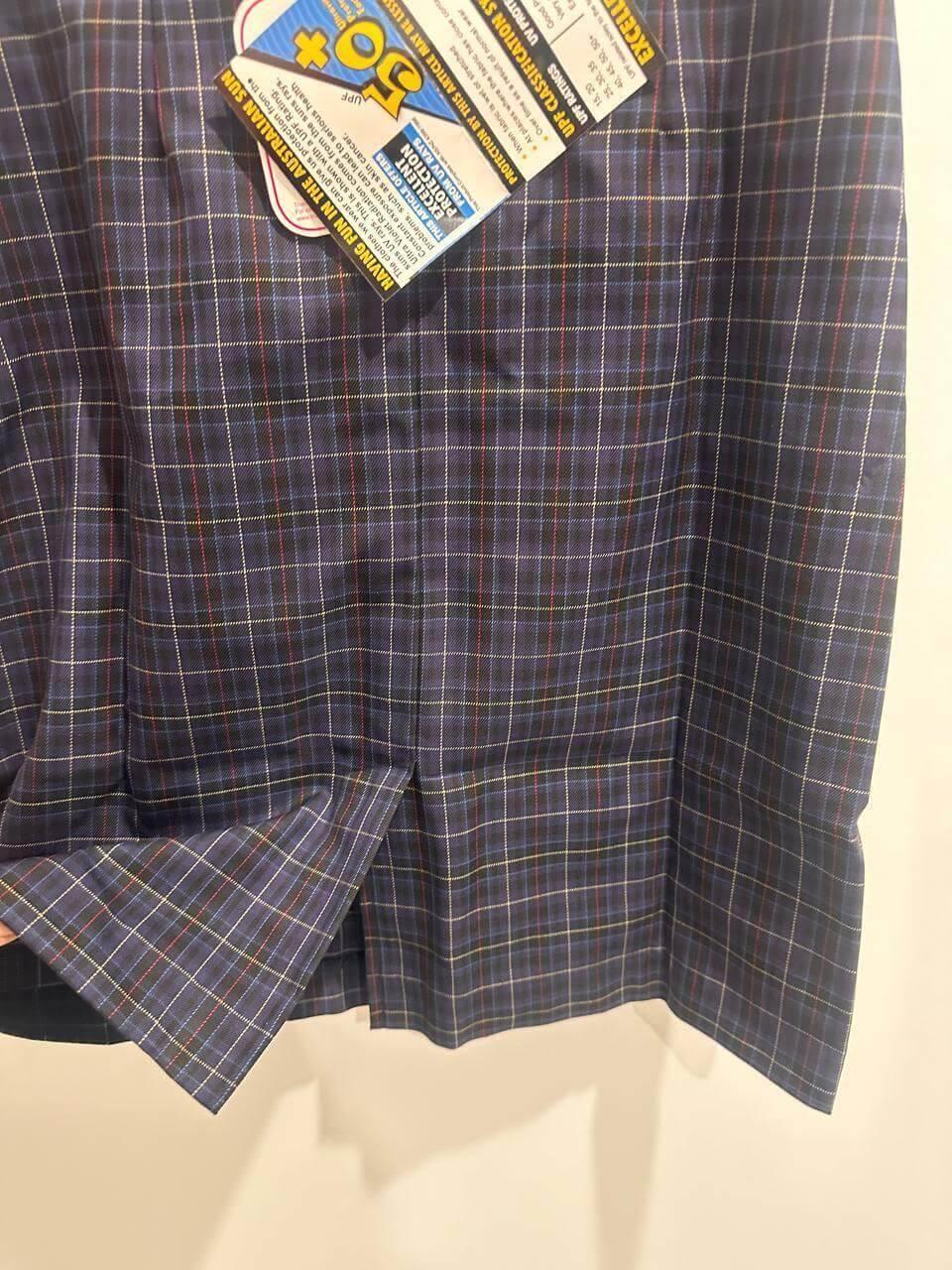 Plaid workwear shirt with UPF 50+ sun protection tag, ideal for outdoor jobs