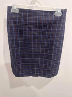Blue plaid workwear skirt with white and red lines, hanging on display hanger