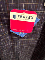 Trutex schoolwear tag on plaid uniform pants, ethically produced durable school clothing