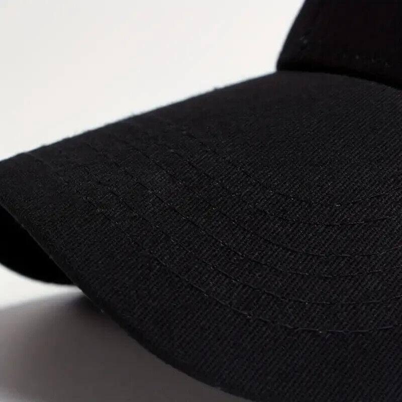 Black baseball cap with textured fabric and curved brim