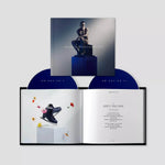 Robbie Williams XXV album with blue vinyl and lyric book featuring ice skates and flowers