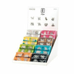 Assorted animal-shaped metal paper clips in colorful packs, displayed in a retail office supply stand.