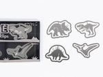 Steel dinosaur-shaped paper clips for documents, assorted metal office clips on white background