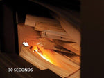 Wood burning in stove with glowing embers, 30 seconds timer visible