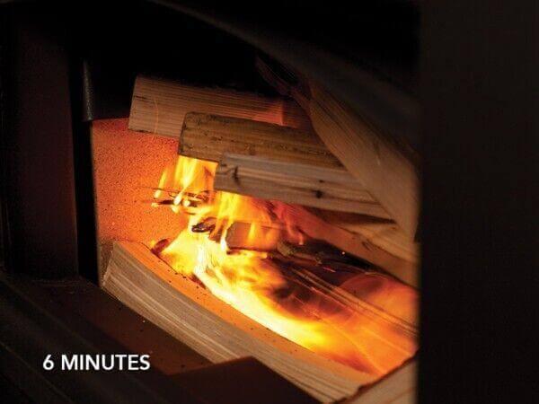 Wood burning in stove with glowing flames and text 6 minutes