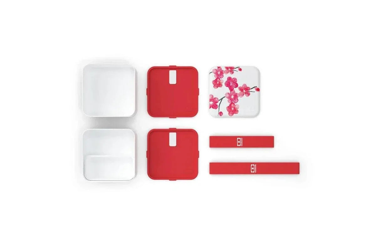 Red and white lunch boxes with floral design and matching straps