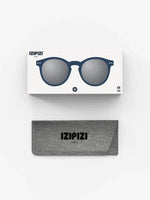 IZIPIZI Paris sunglasses in navy blue frame with silver lenses, displayed with branded case and packaging