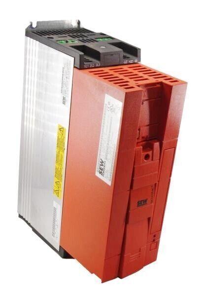 Red and silver SEW industrial motor drive with warning label and ventilation slots