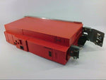 Red industrial electronic module with connectors and mounting brackets