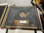 Aramid industrial mat with grid design and label, suitable for heavy-duty use in workshops or warehouses.