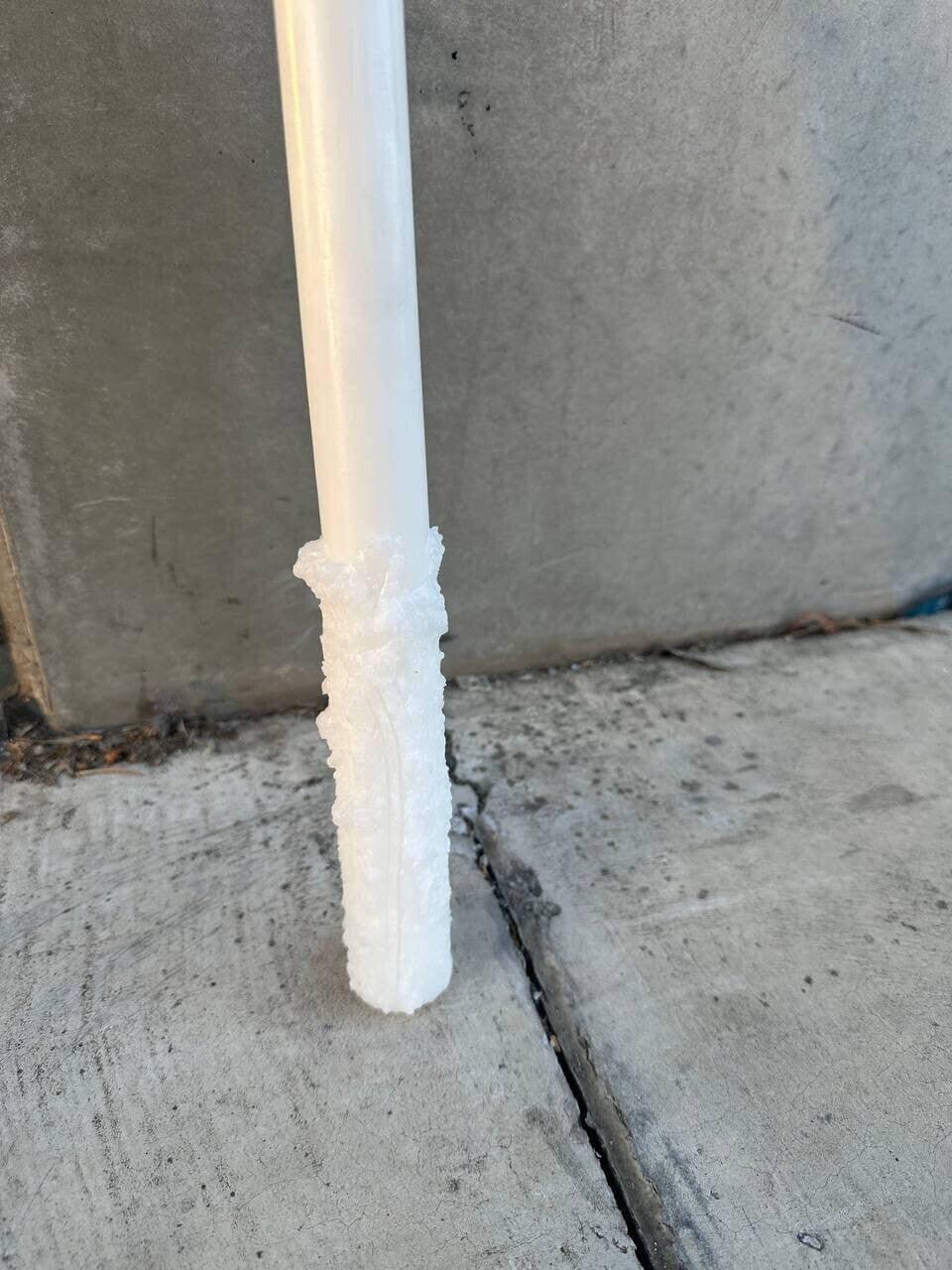White plastic pipe with textured grip, suitable for industrial or agricultural use