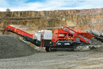 Sandvik UH440i mobile crusher in quarry operation, processing aggregates with conveyor system