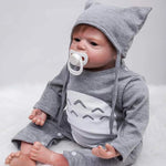 Baby doll in gray cat-ear hoodie with pacifier, soft plush design