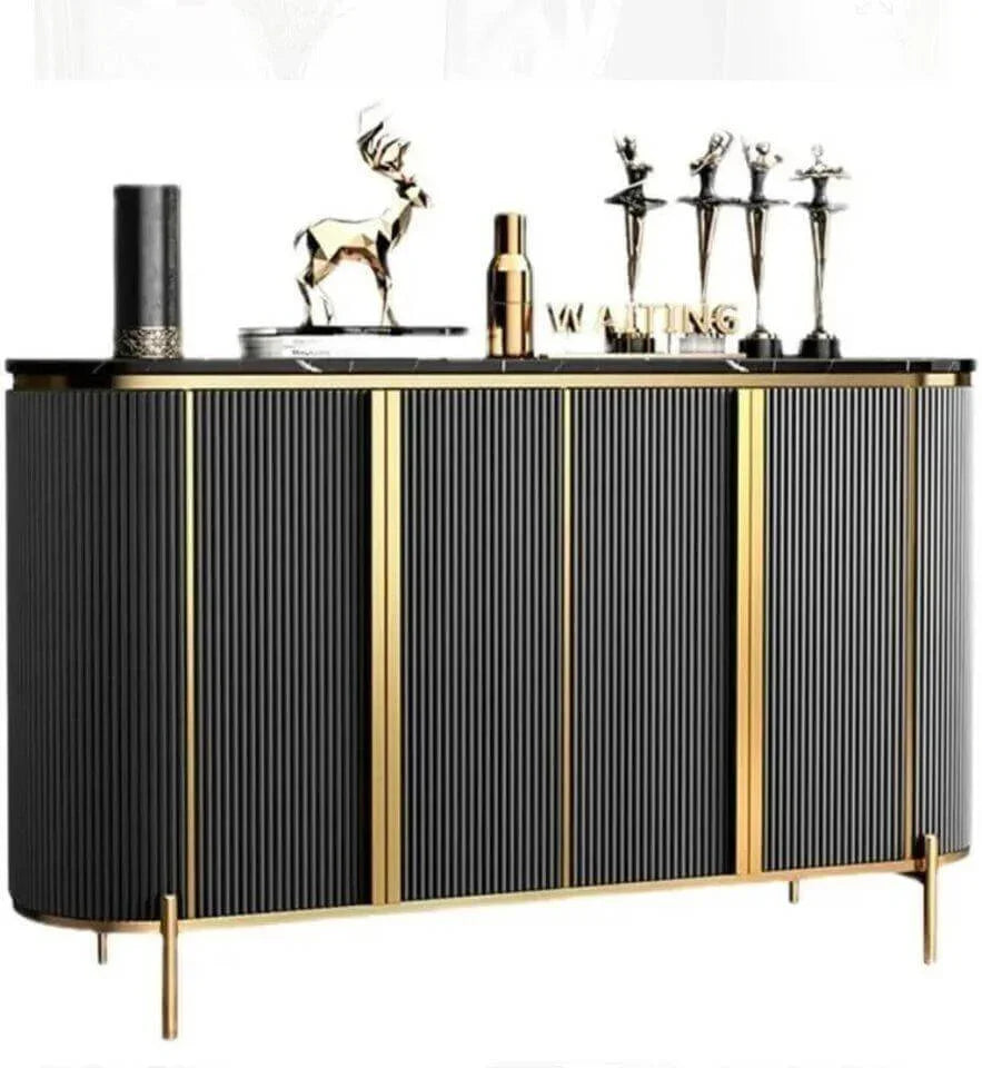 Modern black and gold sideboard with ribbed panels, marble top, and decorative items for luxury home decor