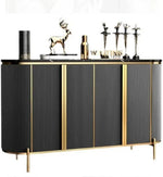 Modern black and gold sideboard with ribbed panels, marble top, and decorative items for luxury home decor