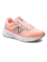 Pink New Balance running shoe with silver N logo, breathable mesh upper, and white cushioned sole