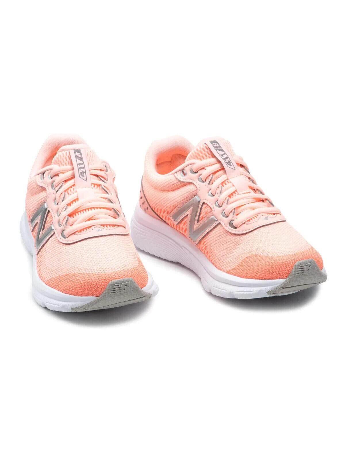 Pink New Balance 411 running shoes with white soles and silver accents