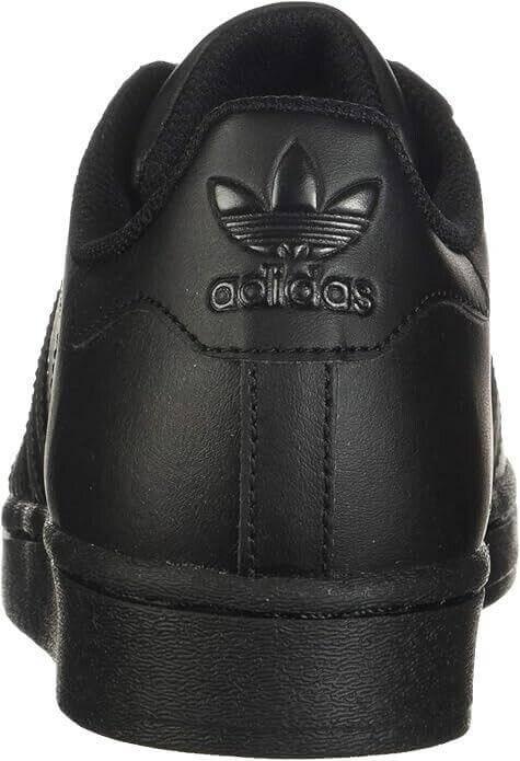 Black Adidas sneaker with iconic trefoil logo and textured sole design