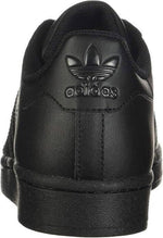 Black Adidas sneaker with iconic trefoil logo and textured sole design