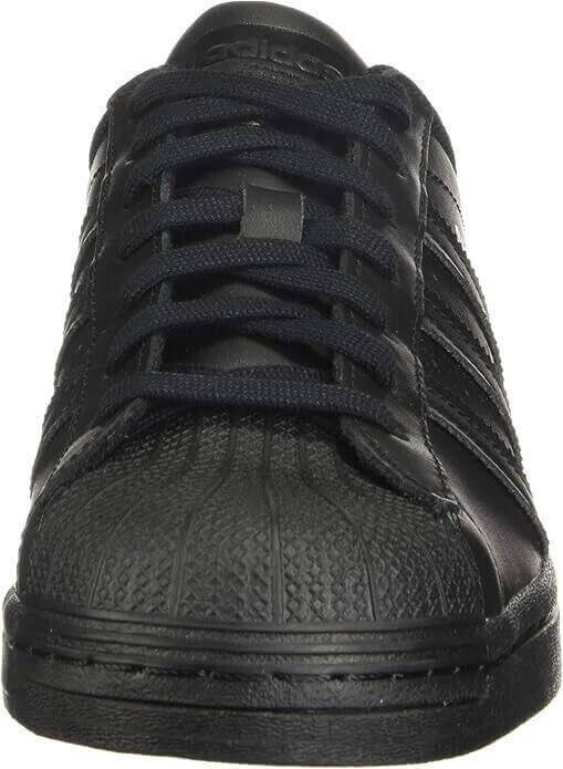 Black Adidas Superstar sneaker with textured toe cap and classic shell-toe design