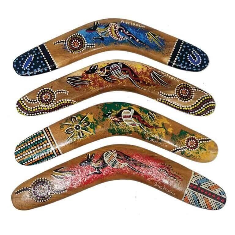 Four hand-painted Australian boomerangs with Aboriginal dot art designs, featuring wildlife and cultural motifs.
