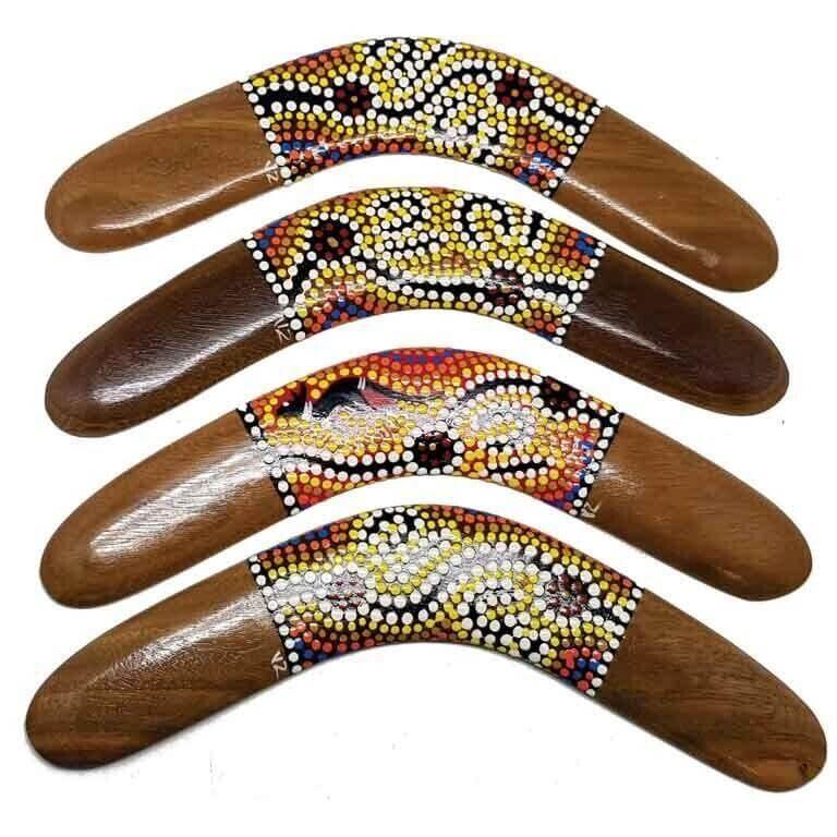 Hand-painted wooden boomerangs with Aboriginal dot art designs, colorful patterns, traditional Australian craftsmanship