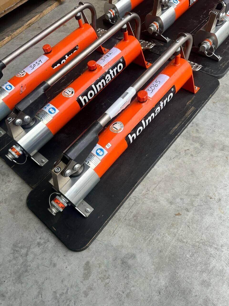 Holmatro hydraulic rescue tools, orange rescue equipment for emergency extrication, heavy-duty rescue gear