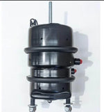 Black industrial air compressor with red valves and metal bolts, ideal for tractor parts and heavy machinery