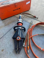Holmatro hydraulic rescue tool with orange hoses and PowerPak case, heavy-duty emergency equipment