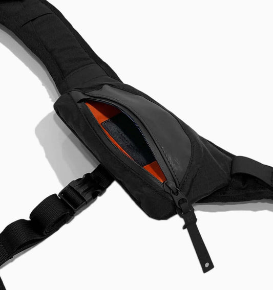 Close-up of Code of Bell Backpack Harness Kit showing sleek design and orange interior pocket.
