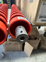 Red tractor parts with metal fittings, stored in warehouse boxes