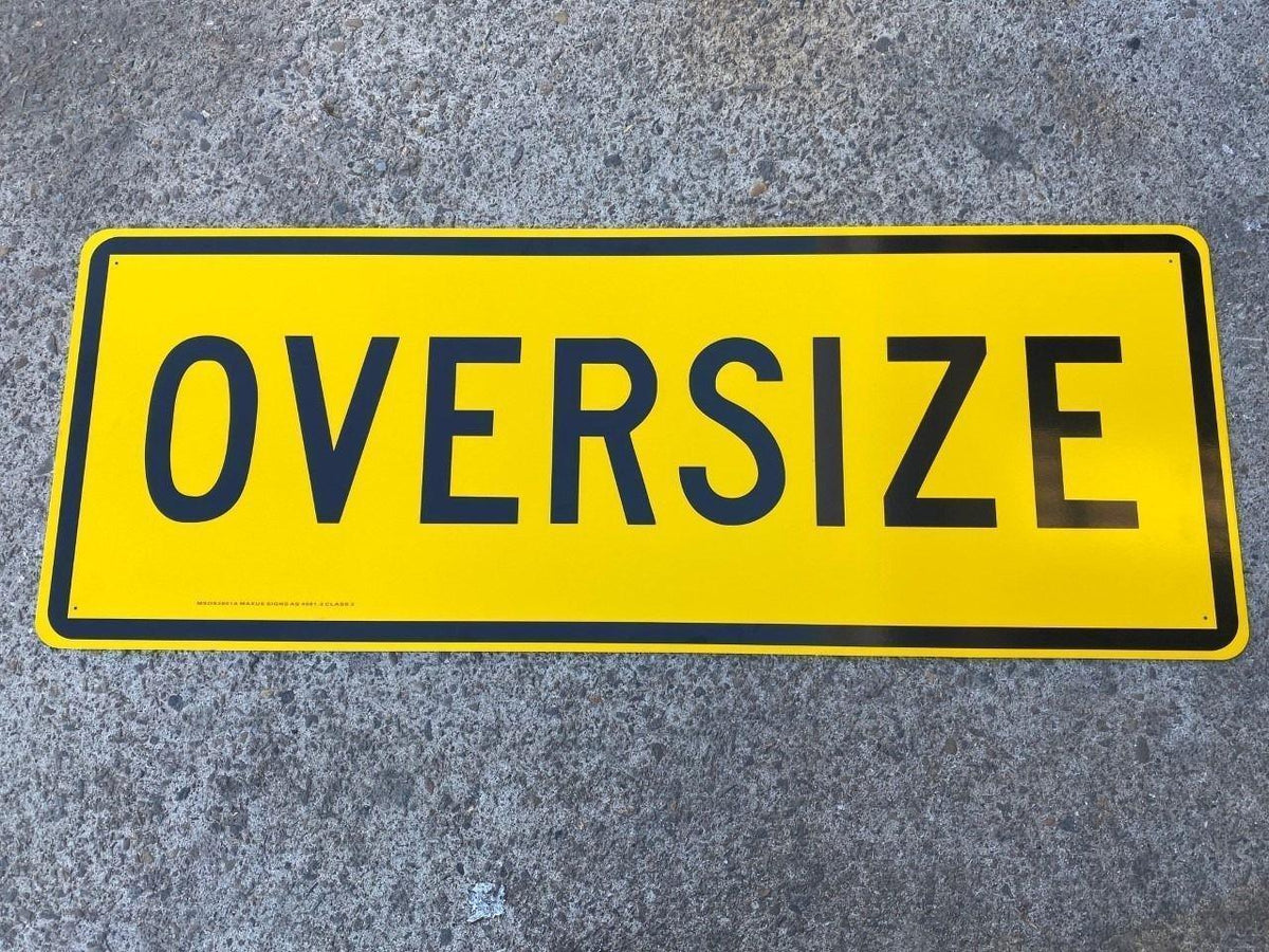 Yellow oversize warning sign for truck transport, heavy equipment, or industrial use