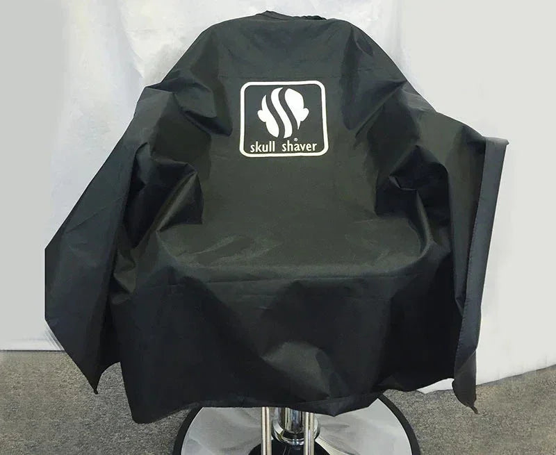 Black Skull Shaver barber chair cover with logo, durable salon cape for hair cutting stations