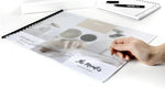 Clear PVC table cover with coffee shop design, protecting menu on white desk