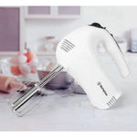 White Westinghouse hand mixer with beaters on kitchen counter, ideal for baking and cooking tasks