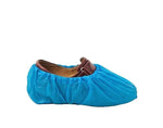 Blue disposable shoe cover over brown leather shoe for workwear protection